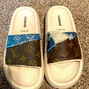 Louis Vuitton up-cycles canvas slides.  Swarovski crystal accents